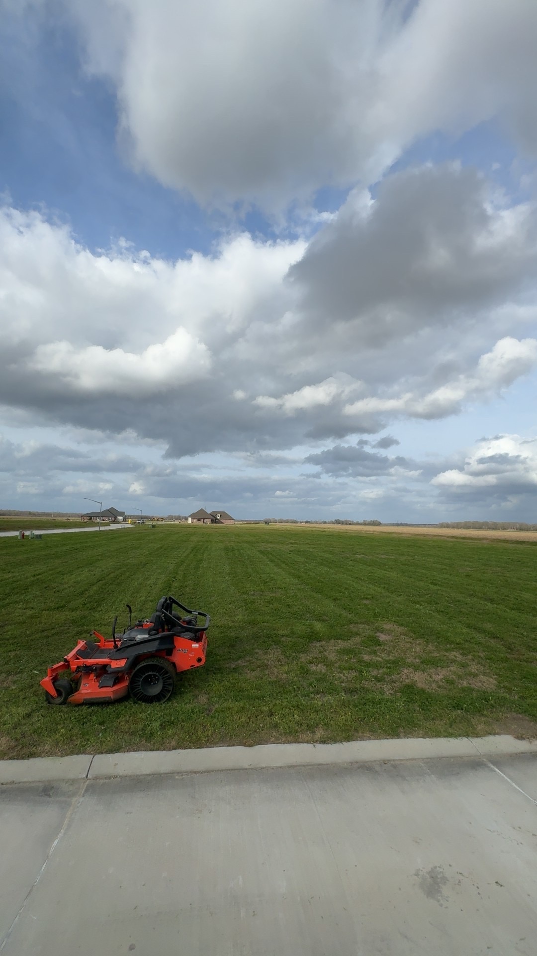 Kubota zero-turn mower on a large lawn